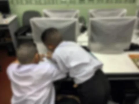 Blurred children student during study computer e-learning in the classroom. Stock Photos