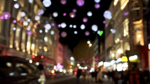 Blurred Christmas lights, red buses and black cabs on busy Oxford Street. Stock Footage 100624337