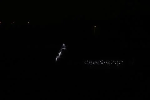 Blurred Christmas String Lights on Dark Background, Defocused Fairy Lights Stock Photos