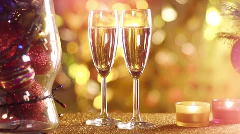 Blurred christmas tree and two champagne glasses Stock Footage 56733702