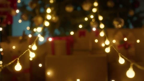 Blurred christmas tree with lights hanging background Stock Footage 255587786