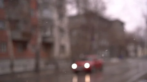 Blurred city background with falling snowflakes Video stock 88640268