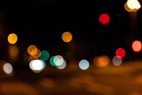 Blurred city lights of an intersection at night Stock Photos