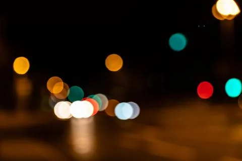 Blurred city lights of an intersection at night Stock Photos