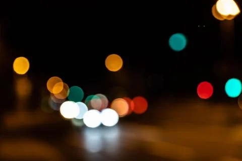 Blurred city lights of an intersection at night Stock Photos