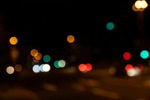 Blurred city lights of an intersection at night Stock Photos