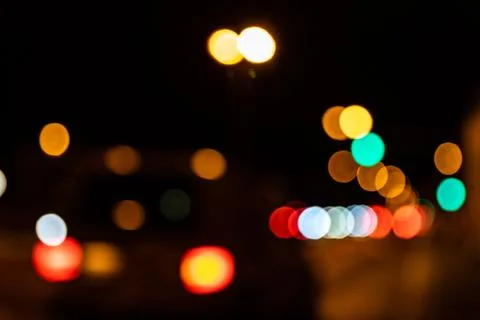 Blurred city lights of an intersection at night Stock Photos