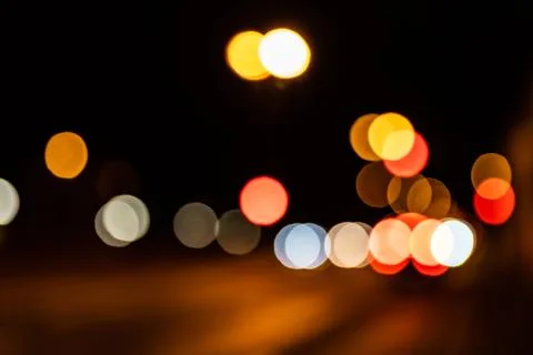Blurred city lights of an intersection at night Stock-Fotos