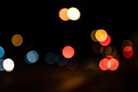 Blurred city lights of an intersection at night Stock Photos