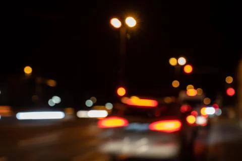 Blurred city lights of an intersection at night Foto stock