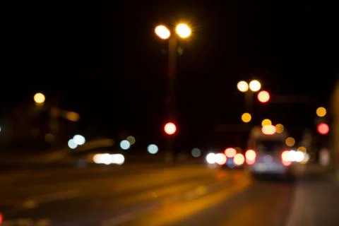 Blurred city lights of an intersection at night Foto stock
