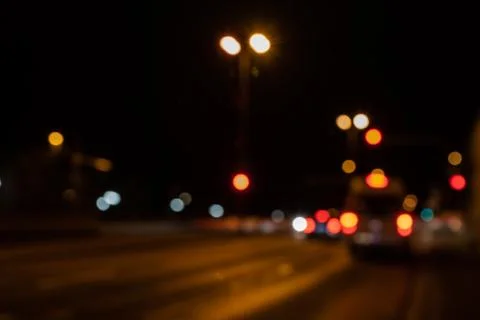 Blurred city lights of an intersection at night Foto stock