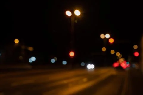 Blurred city lights of an intersection at night Foto stock