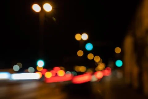 Blurred city lights of an intersection at night Stock Photos