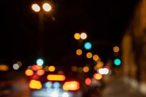 Blurred city lights of an intersection at night Stock Photos