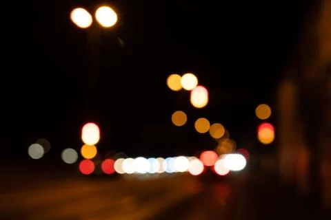 Blurred city lights of an intersection at night Stock Photos
