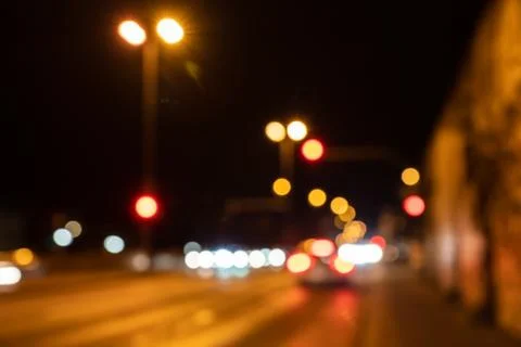 Blurred city lights of an intersection at night Stock Photos