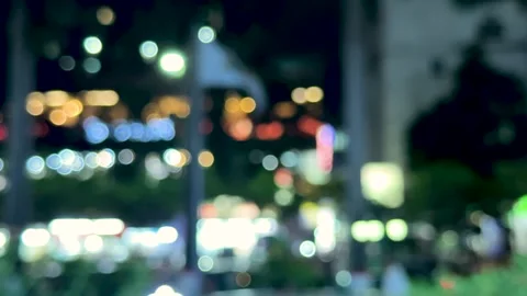 Blurred city lights at night creating a dreamy bokeh effect with vibrant co.. Stock Footage 339296028