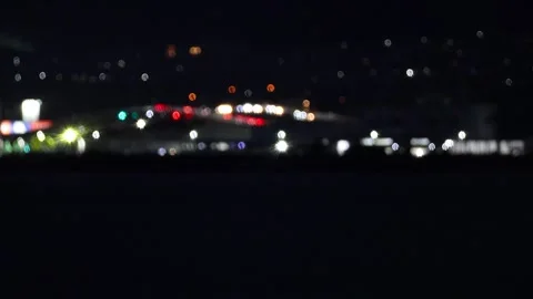 Blurred city lights reflection and sound of waves ASMR at regional city,4K Видео 345395578