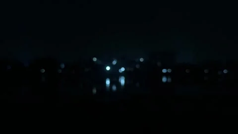 Blurred cityscape at night with distant lights creating a mysterious and se.. Stock-Footage 340052530