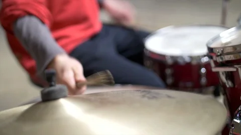 Blurred Close up of man playing the drums, red drum set and red outfit Stock Footage 104470539
