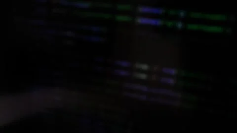 Blurred code moves on screen with handheld camera creating abstract hacking.. Stock Footage 334336308