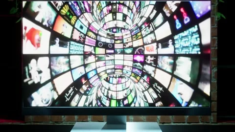 Blurred collage animation in screen of computer monitor in office room with  Stock Footage 246680582