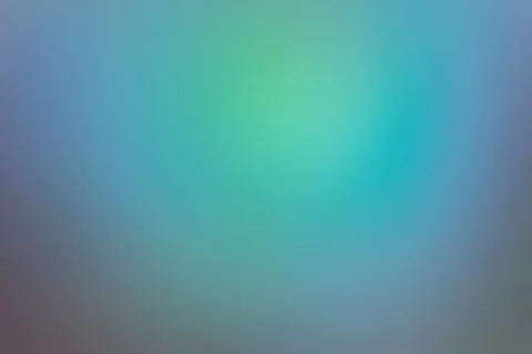 Blurred colored abstract background with a green-blue spot of light. Stock Photos