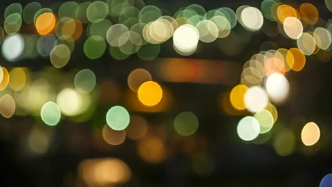 Blurred coloured bokeh lights of car and trucks Stock Footage 137456057
