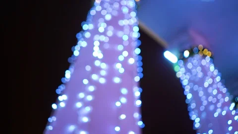 Blurred columns decorated with blue lights for holiday Stock Footage 121842940