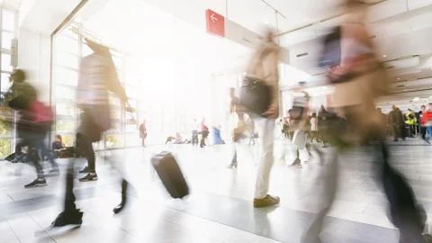 Blurred commuters walking by Photos