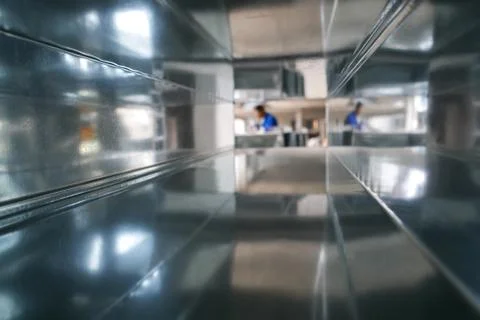 Blurred Construction Worker Through Air Duct Stock-Fotos
