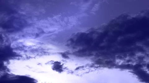 Blurred creative cloudscape on the sky Very Peri tones. Stock Photos