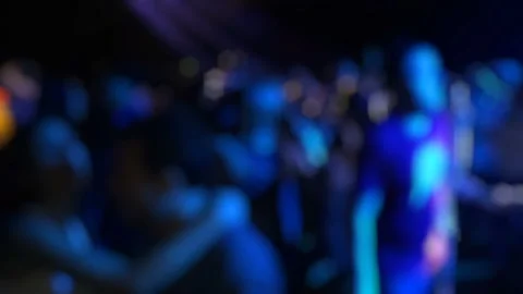 Blurred Crowd Dancing at Night Club Party with Colorful Lights Stock Footage 348242542