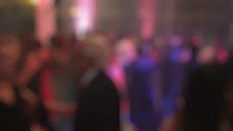 Blurred Crowd Dancing at Night Party with Colorful Lights Stock Footage 348242537