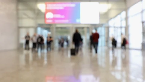 Blurred crowd of people at convention passing through hallway Stock Footage 119022159