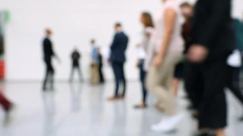 Blurred crowd of people passing close by in a hallway Stock Footage 119823679