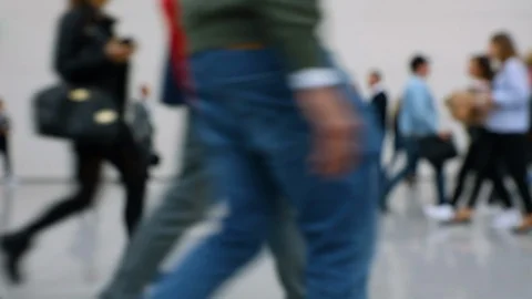 Blurred crowd of people passing close by at a business fair Stock Footage 123280991