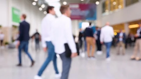 Blurred crowd of people passing by at a conference Stock Footage 122204108
