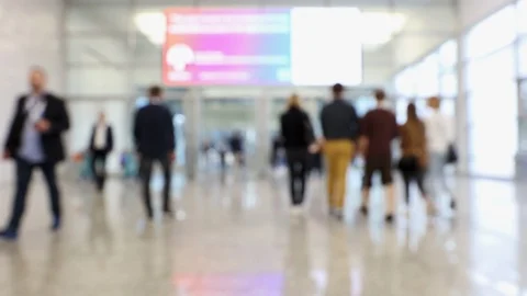 Blurred crowd of people passing conference hallway Stock Footage 122204355