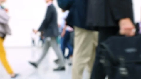 Blurred crowd of people passing by in a hallway at conference Stock Footage 122573019