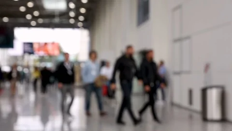 Blurred crowd of people passing by in hallway during trade fair Stock Footage 123835278