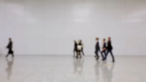 Blurred crowd of people passing by in one direction at a convention Stock Footage 119022017