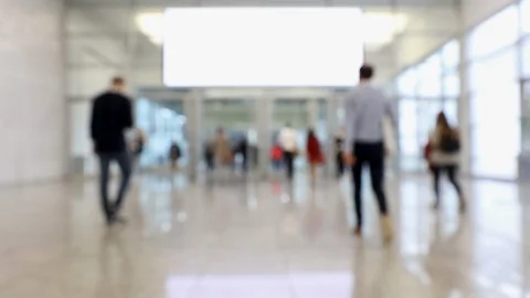 Blurred crowd of people passing through a hallway during convention Stock Footage 120401798