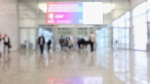 Blurred crowd of people passing through a conference center Stock Footage 123281162