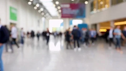 Blurred crowd of people walking around exhibition hall Stock Footage 116026322