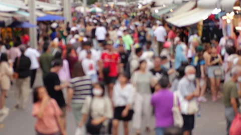 Blurred crowd of people walking at Chatuchak Market in Bangkok Stock Footage 326375302