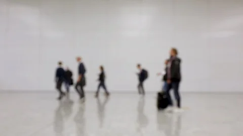Blurred crowd of people walking by in one direction at a convention Stock Footage 119823725