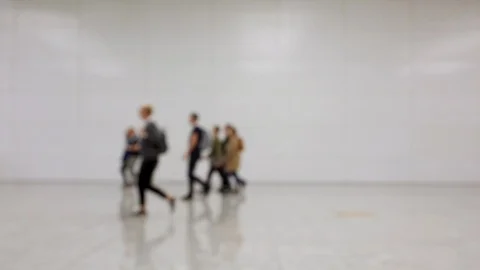 Blurred crowd of people walking by in one direction Stock Footage 120138733