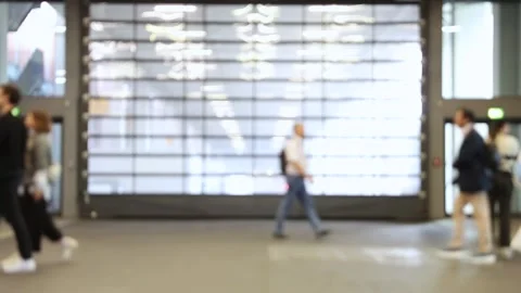 Blurred crowd of people walking through the shot at a trade fair. Video stock 334717481